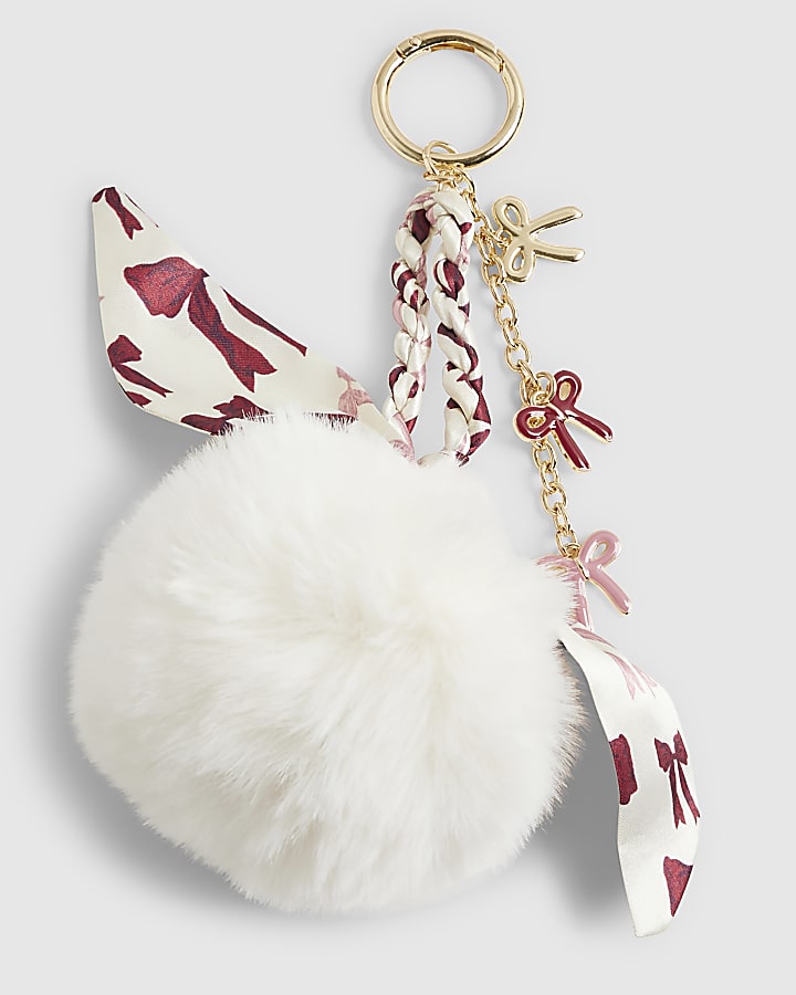 River Island Cream Plaited Scarf Pom Pom Bow Bag Charm