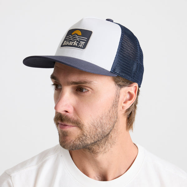 Roark Station Trucker Snapback Hat In White/Navy