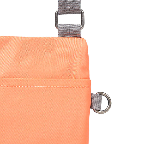 Roka London Chelsea Pocket Sling Bag In Firecracker