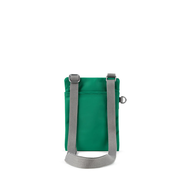 Roka London Chelsea Pocket Sling Bag In Emerald
