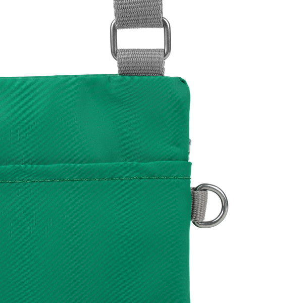 Roka London Chelsea Pocket Sling Bag In Emerald