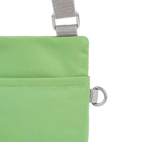 Roka London Chelsea Pocket Sling Bag In Kiwi