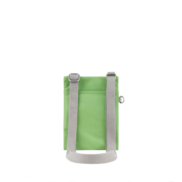 Roka London Chelsea Pocket Sling Bag In Kiwi