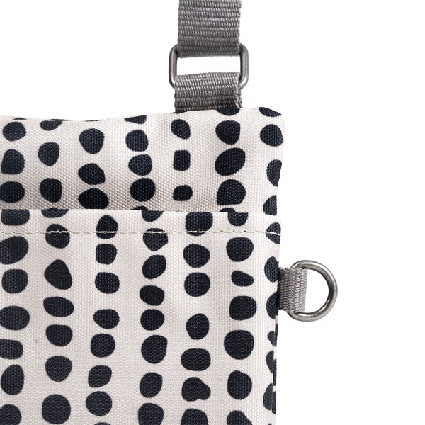 Roka London Chelsea Pocket Sling Bag In Linear Dot