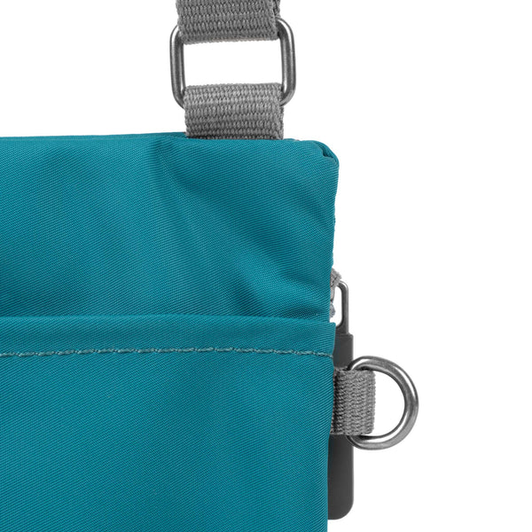 Roka London Chelsea Pocket Sling Bag In Marine