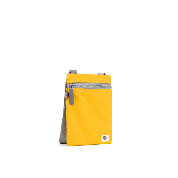 Roka London Chelsea Pocket Sling Bag In Saffron