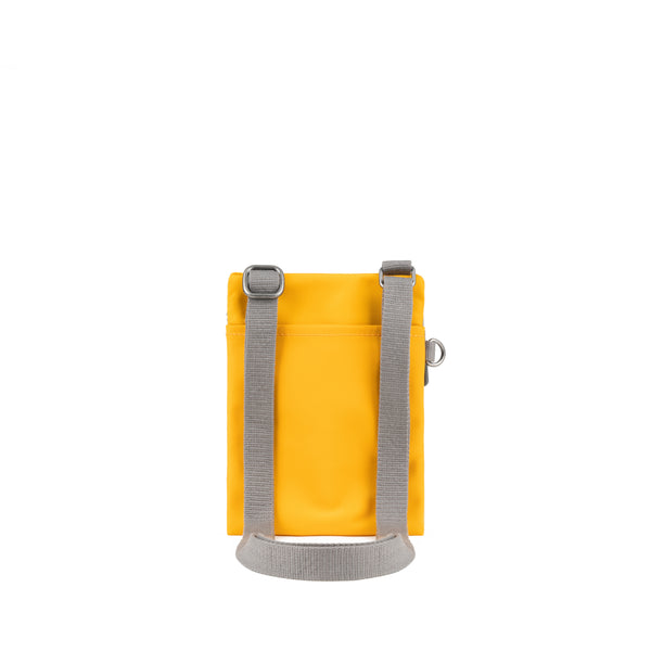 Roka London Chelsea Pocket Sling Bag In Saffron