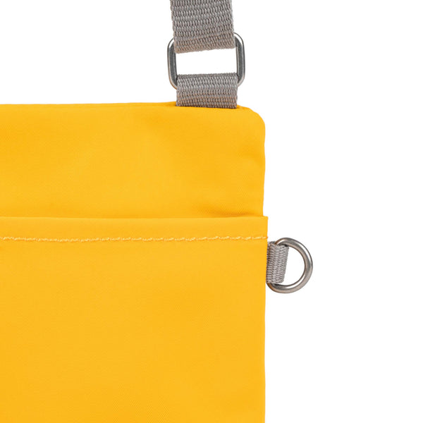 Roka London Chelsea Pocket Sling Bag In Saffron