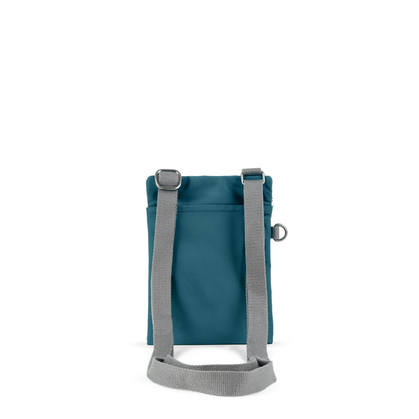 Roka London Chelsea Pocket Sling Bag In Teal