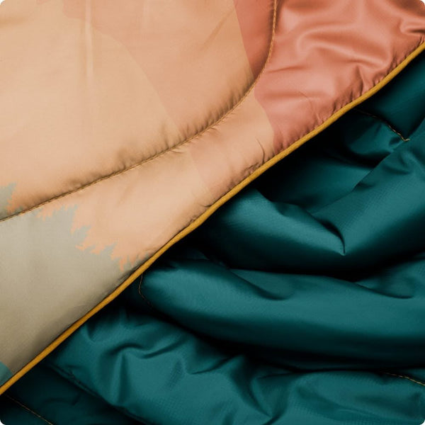 Rumpl Original Puffy Blanket Rocky Mountain Sunset Fade