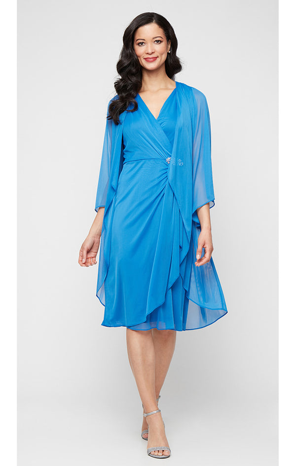 S.L. Fashions Plus Short Mesh Dress with Surplice Neckline Embellished Waist Cascade Ruffle Skirt and Elongated Illusion Jacket