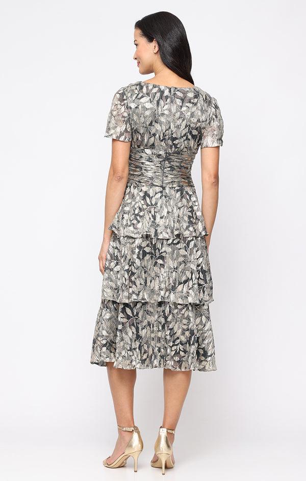 S.L. Fashions Plus Tea Length Printed Lurex Bodre Dress With Ruched Waist Surplice Bodice Cold Shoulder Sleeves And Tiered Skirt