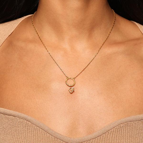 Satya Jewelry Universal Om White Topaz Charm