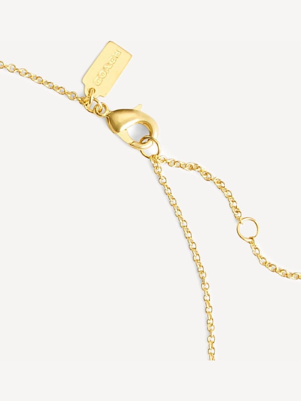 seraphine COACH Gold Tone Pearl Signature Pendant Necklace