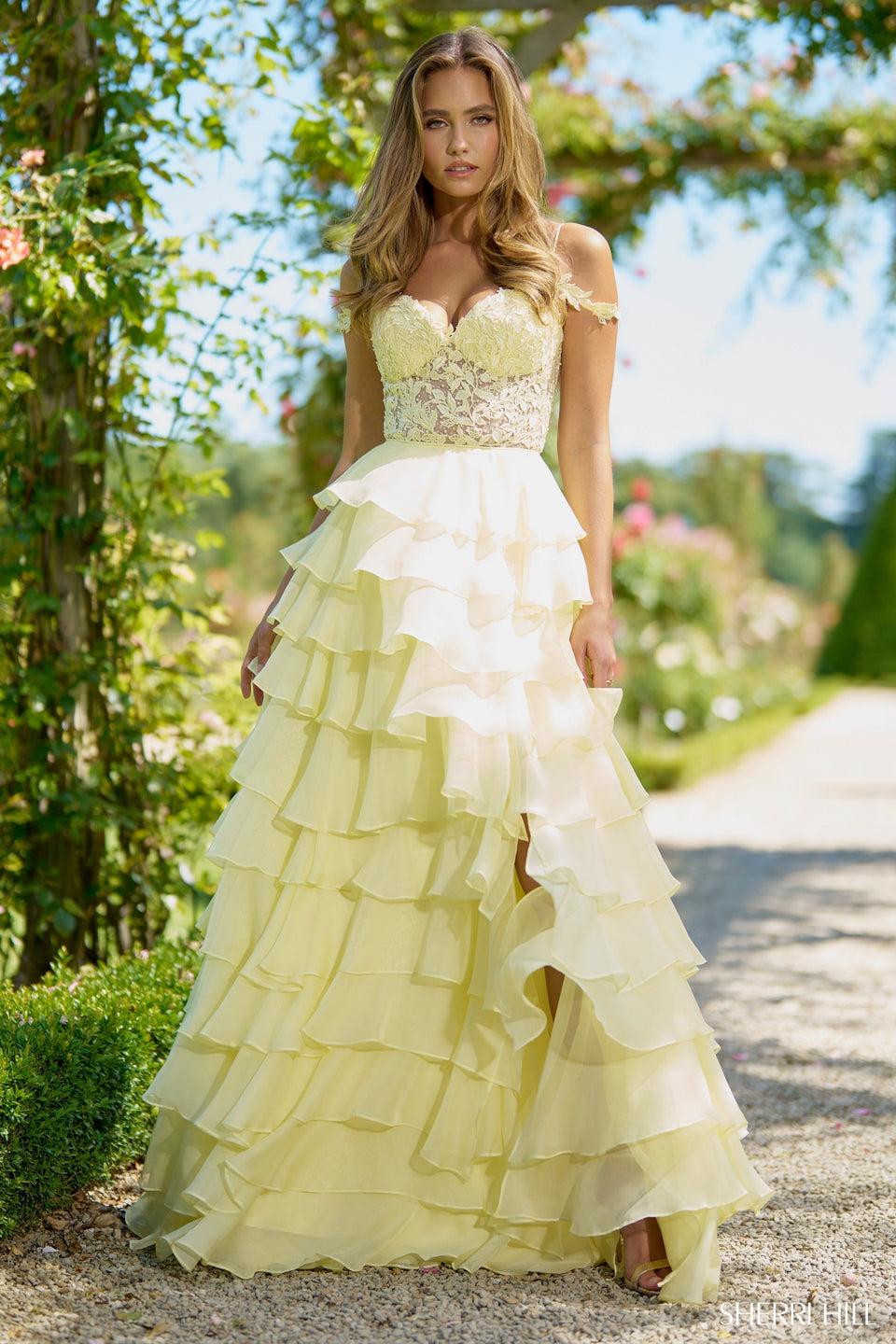sherri hill A line gown with chiffon ruffle skirt corset leaf lace top off the shoulder straps and a skirt slit