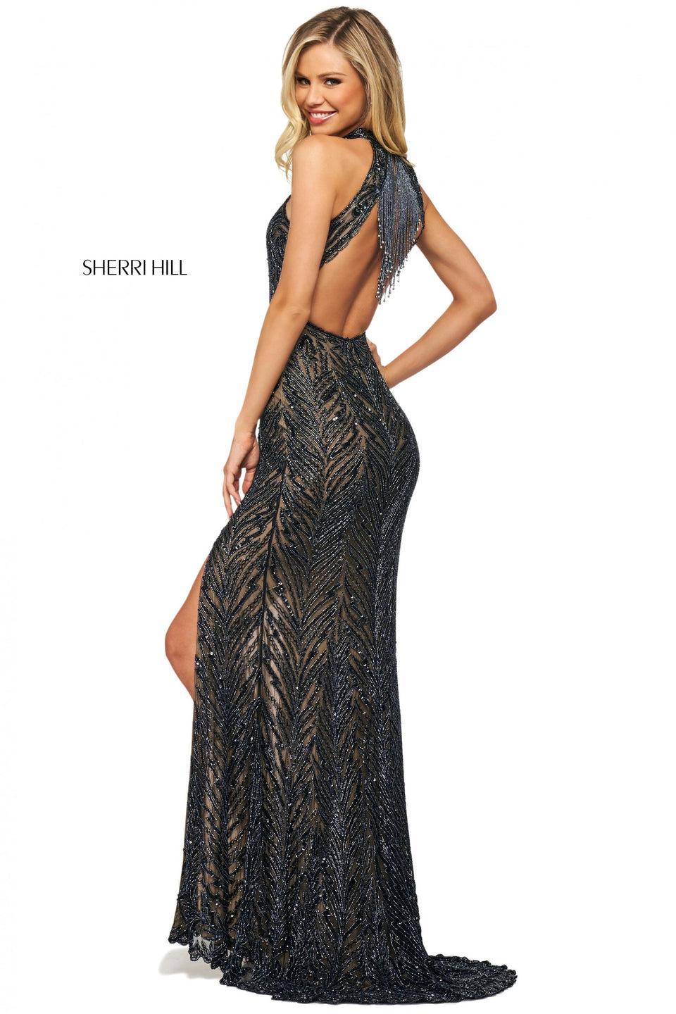 sherri hill Beaded high cut halter neckline gown with beaded fringe on an open back and a skirt slit