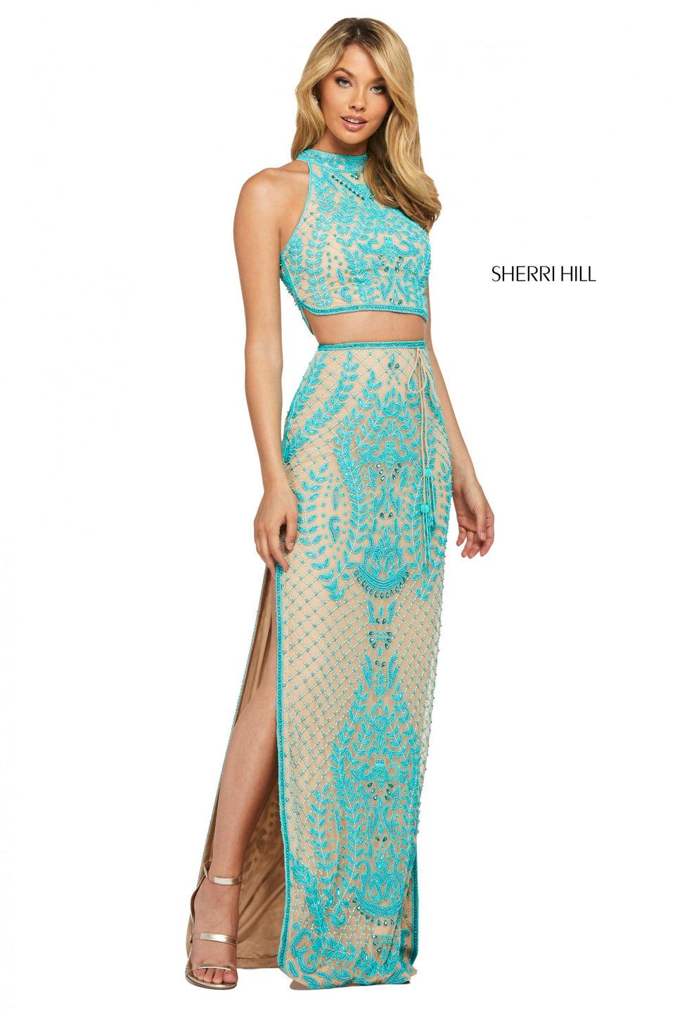 sherri hill Beaded two piece with high cut halter style bodice and skirt with tassel tie belt and double side slits