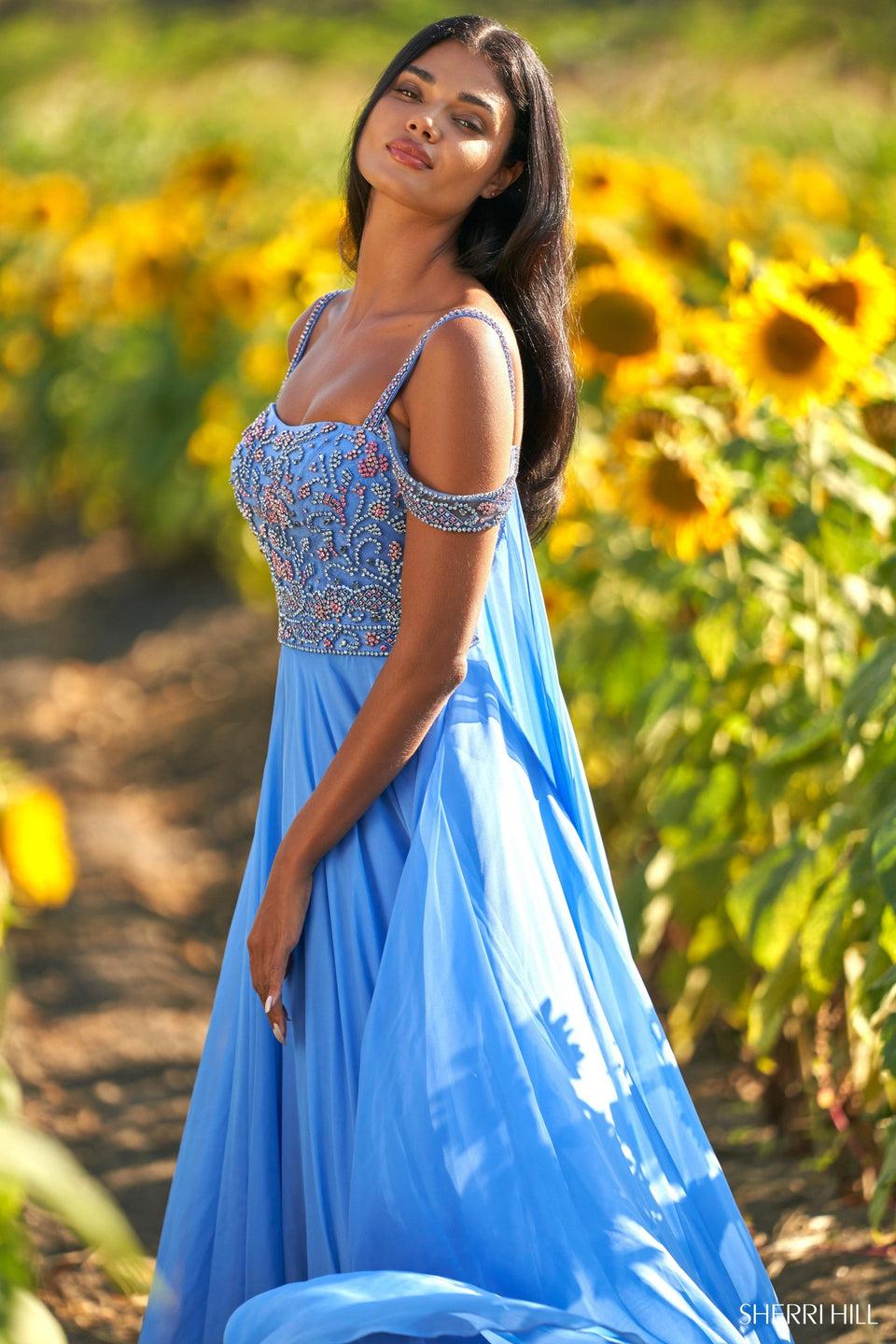sherri hill Chiffon gown with fitted Swarovski bodice. Cape flows from draped crystal embellished shoulder straps