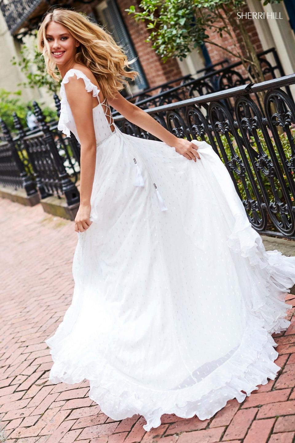 sherri hill Chiffon metallic print dress with ruffles on hem and neckline and a beaded belt