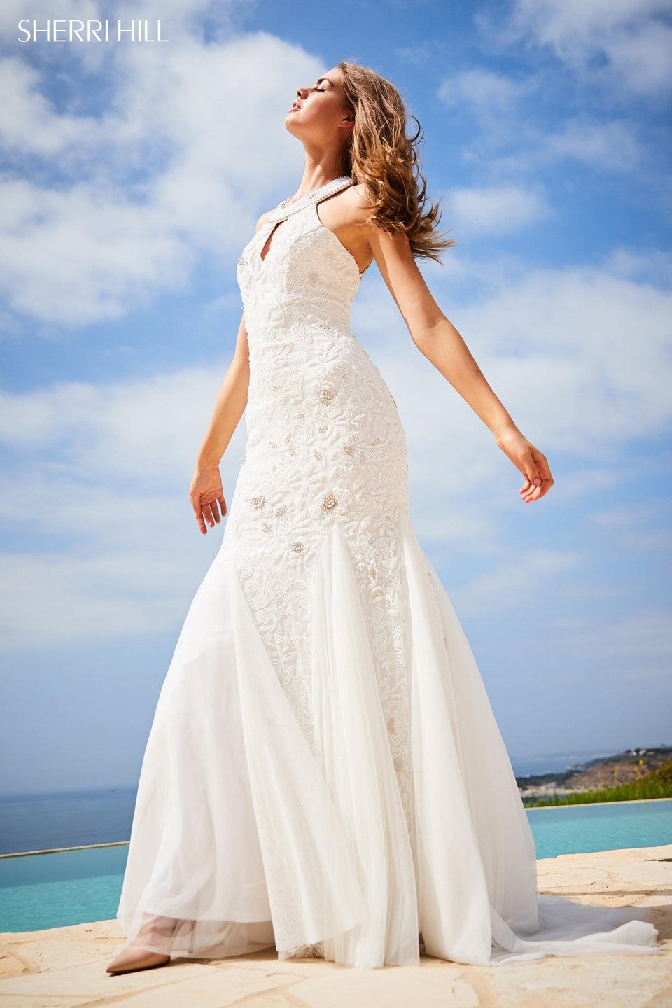 sherri hill Fitted beaded gown with keyhole bodice cut out back and tulle mermaid skirt