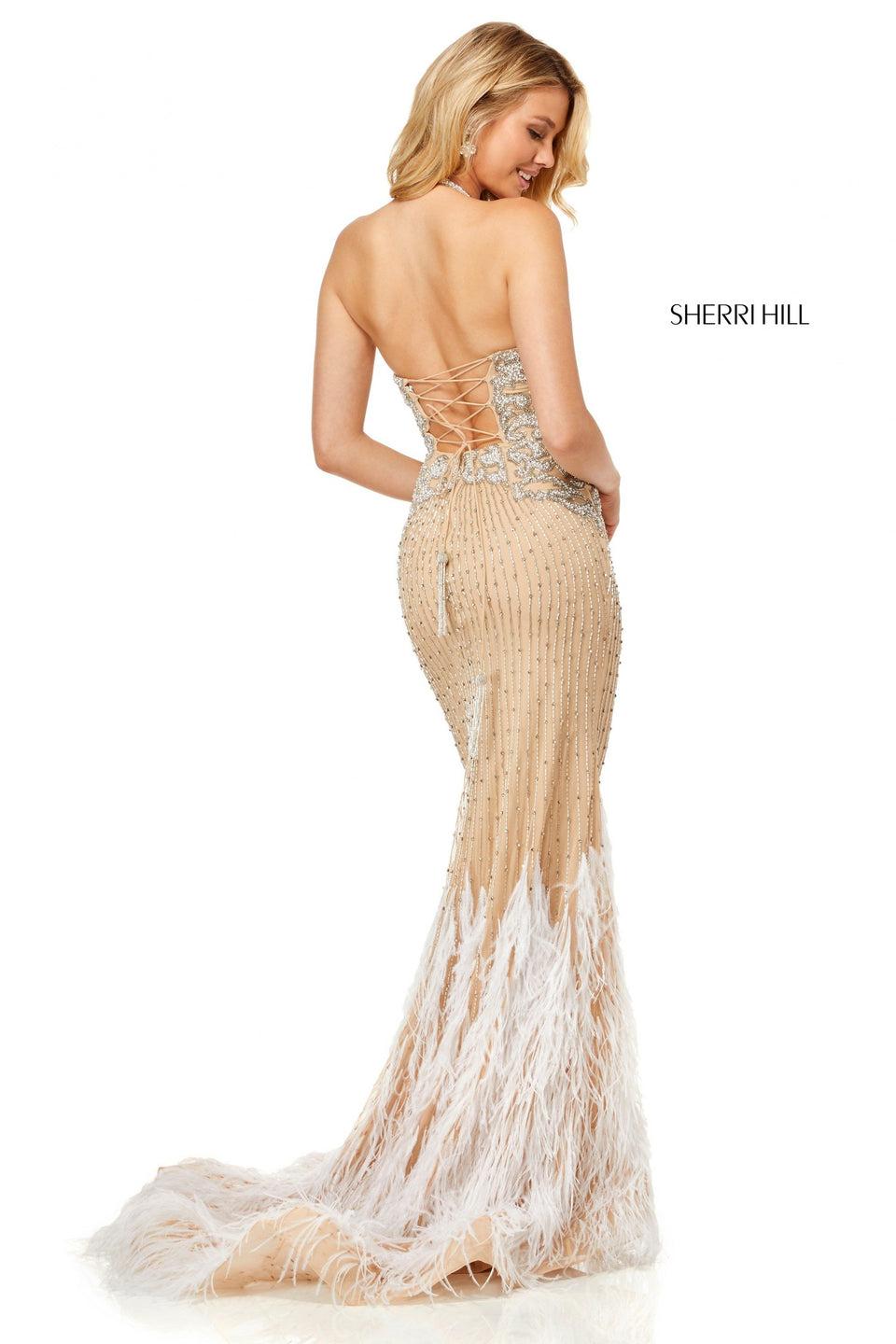 Sherri Hill Fully Beaded Gown With A Halter Neck And Lace Up Back With Feather Details On Bottom Of The Skirt