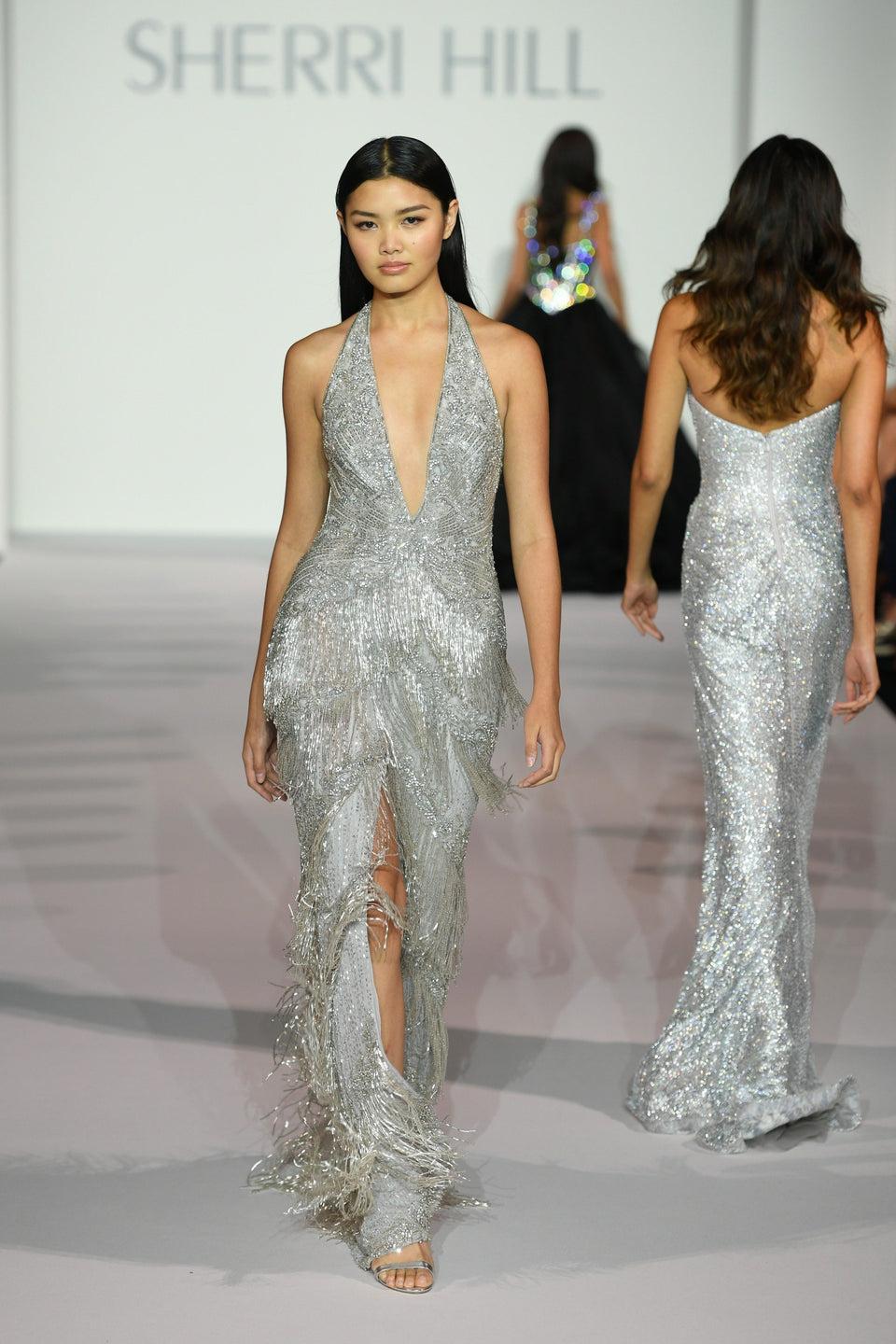 sherri hill Fully beaded halter gown with deep V-Neckline and fringe slit skirt