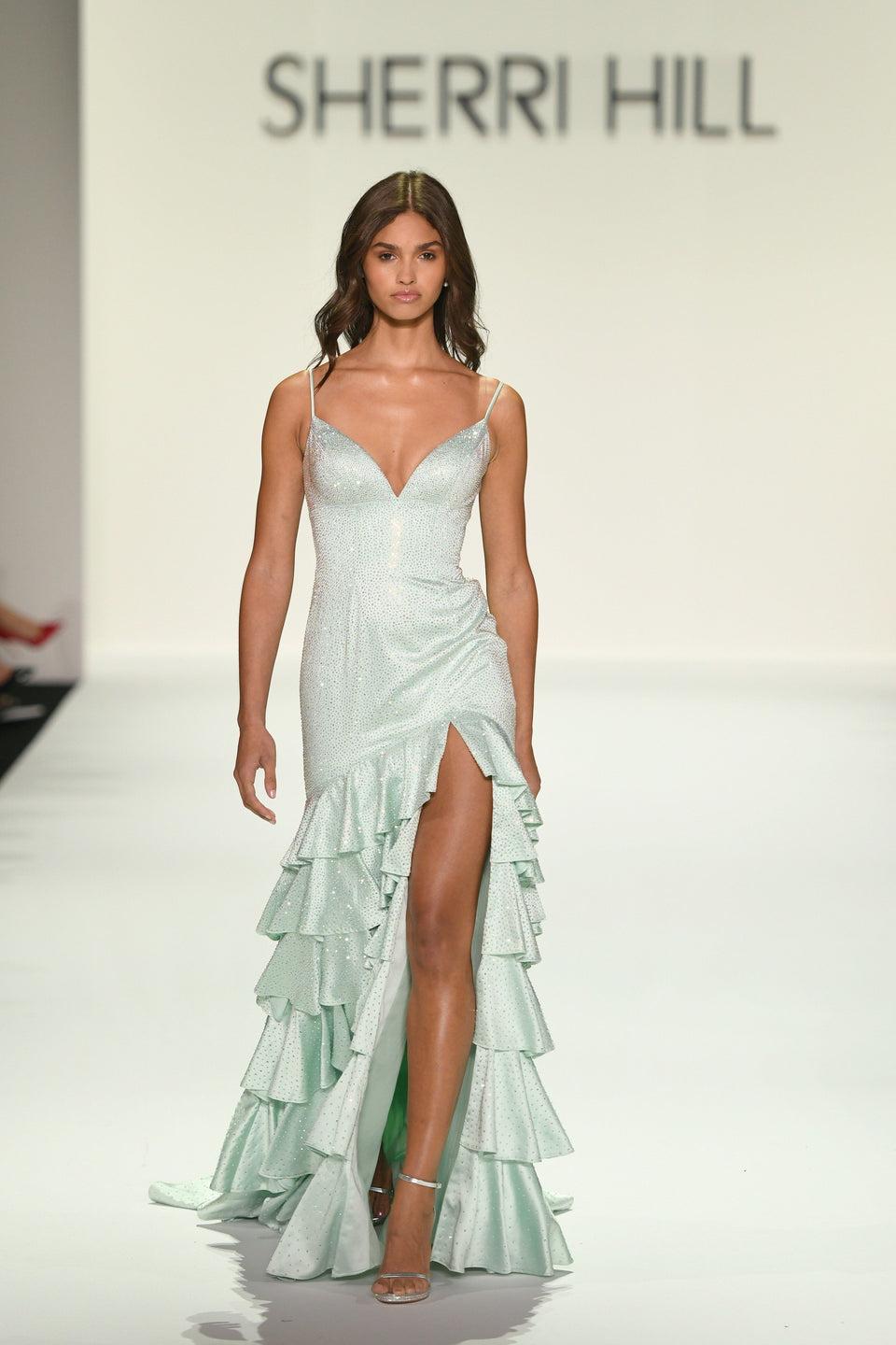 sherri hill Hot fix gown with ruffle skirt sweetheart neckline lace up back and a skirt slit