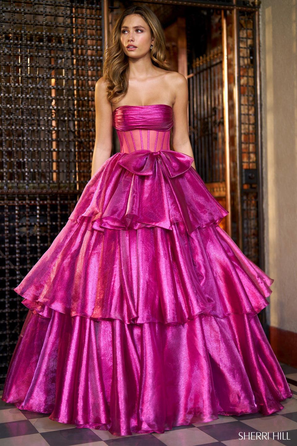 Sherri Hill LamÃ© Strapless Ballgown With Sheer Corset Bodice Bow Embellishment And Ruffle Skirt With Slit