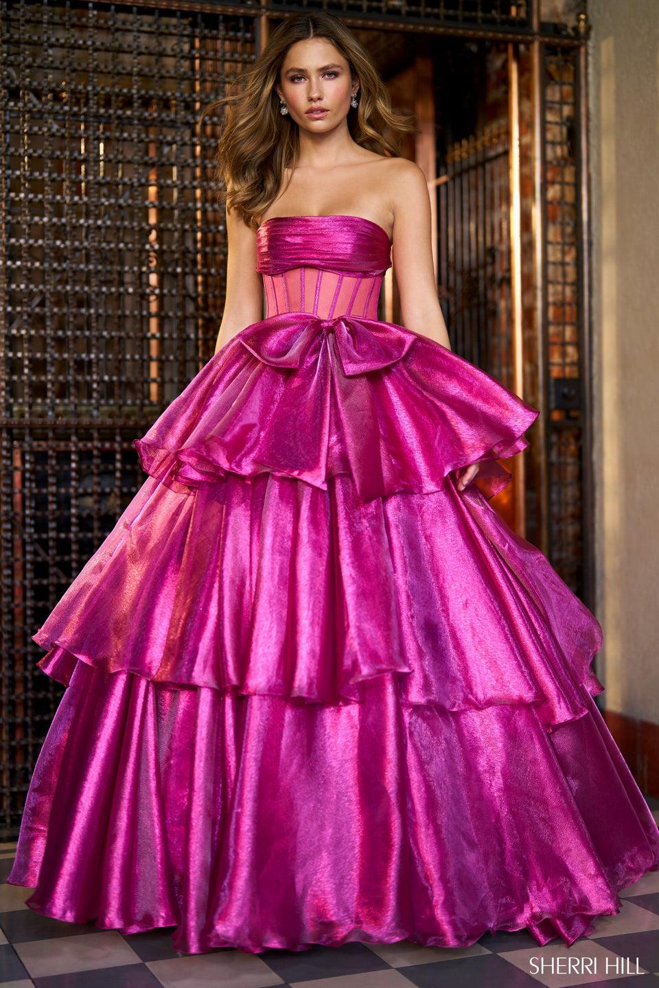 sherri hill LamÃ© strapless ballgown with sheer corset bodice bow embellishment and ruffle skirt with slit