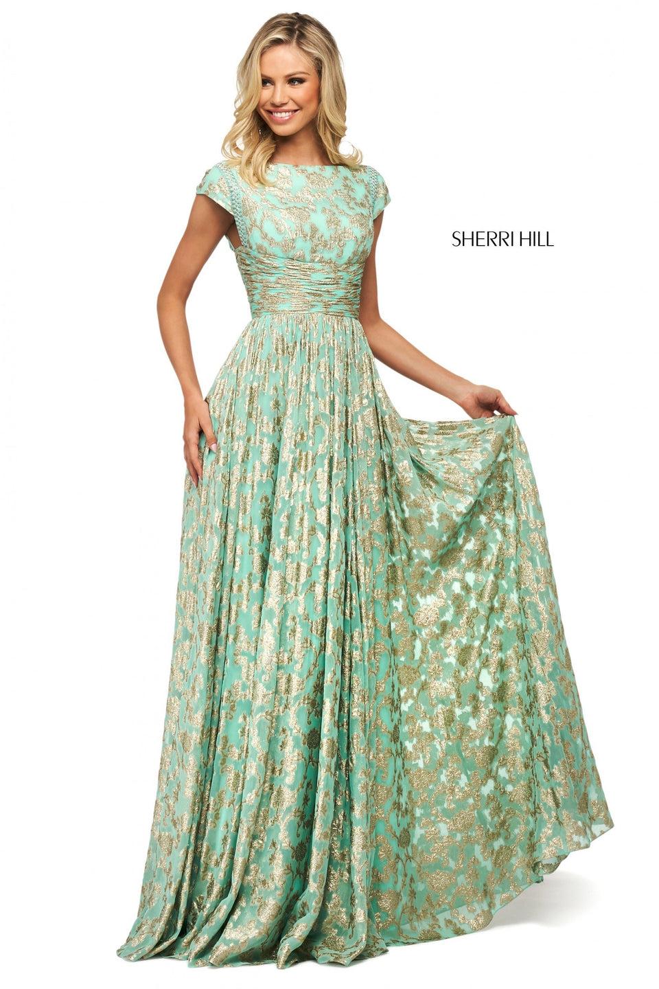 sherri hill Metallic cross dyed gown with bateau neckline cap sleeve bodice ruched waistband and tassel tie
