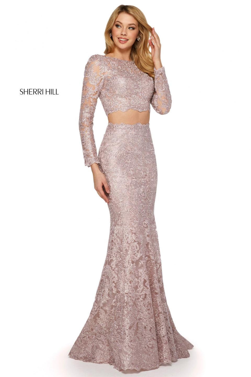 Sherri Hill Metallic Lace Two Piece Gown Featuring Long Sleeve Bateau Neckline Top With Lace Up Back And Long Fitted Skirt With Hemline Flare