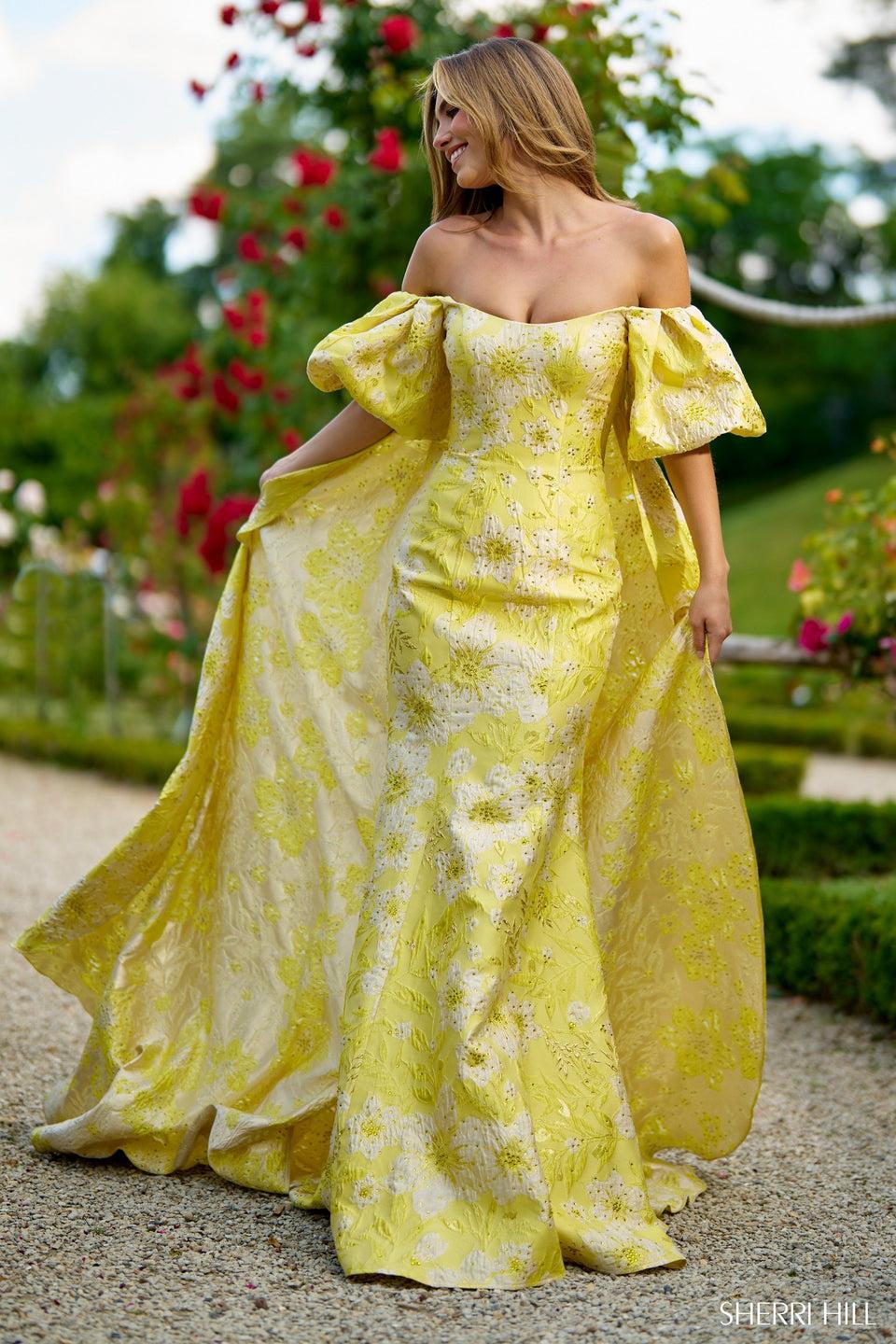 Sherri Hill Off The Shoulder Mermaid Brocade Dress With Balloon Sleeves And A Cape