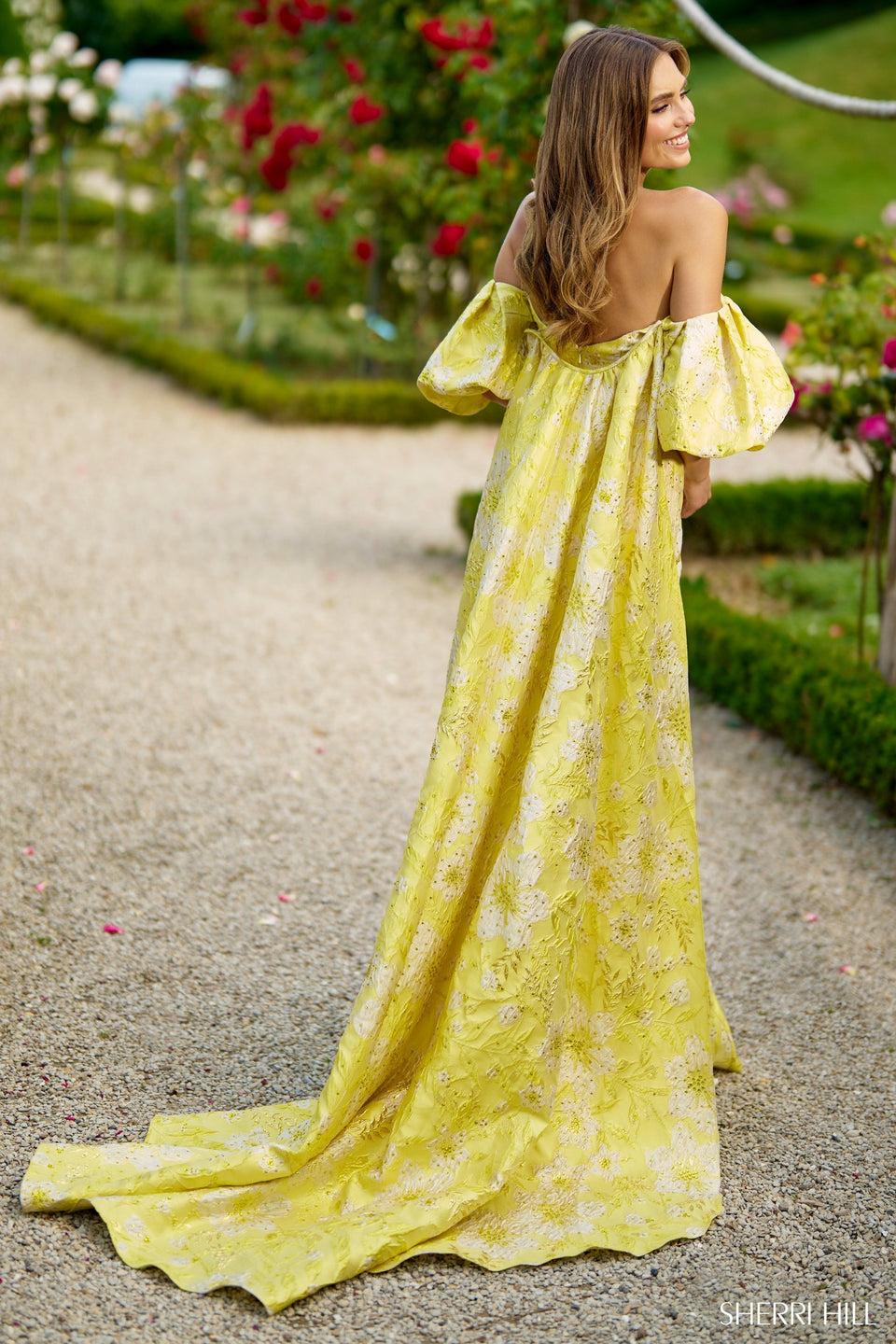 Sherri Hill Off The Shoulder Mermaid Brocade Dress With Balloon Sleeves And A Cape