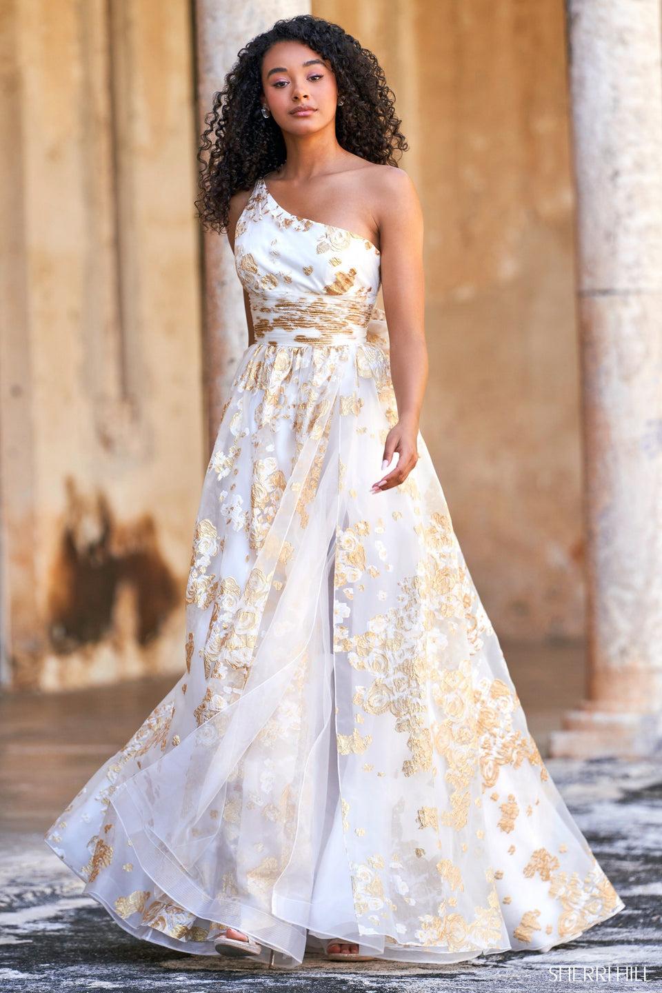 sherri hill One shoulder A-line ballgown with gold metallic print skirt slit and bow on back