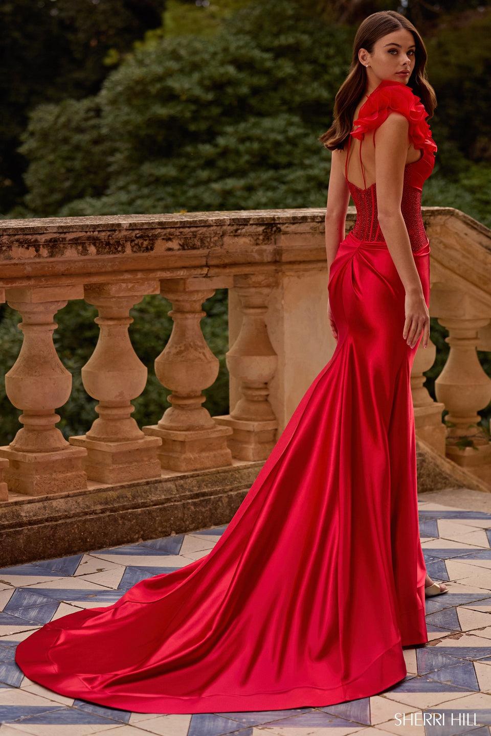 Sherri Hill One Shoulder Gown With Hot Fix Corset Bodice Stretch Satin Skirt With Slit And A Rosette Embellishment