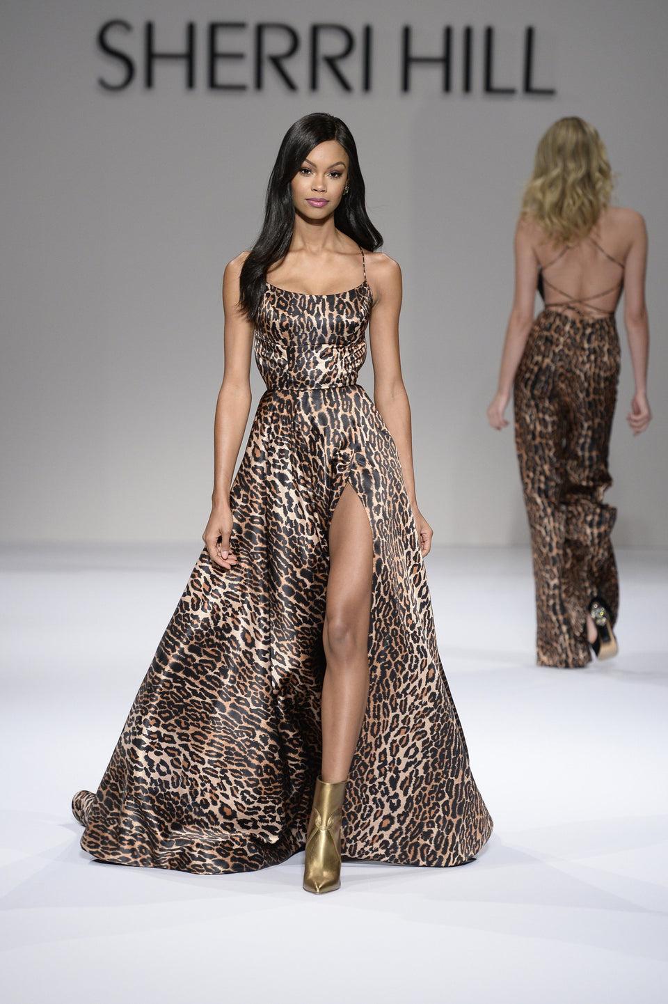 sherri hill Spaghetti strap satin leopard print gown with a side slit and a lace up criss cross back