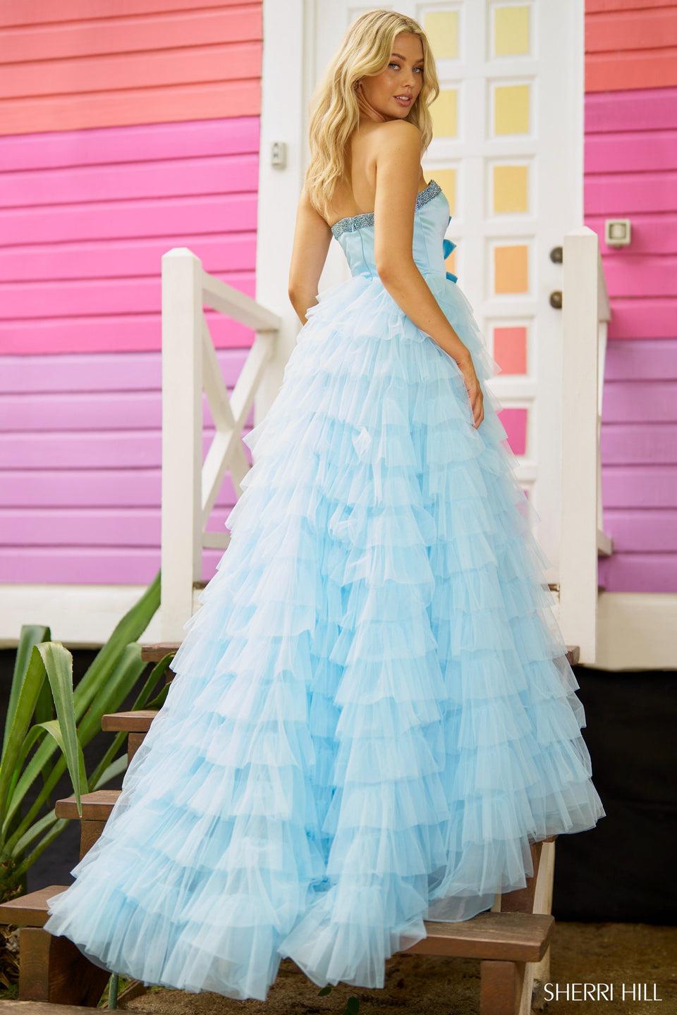 Sherri Hill Strapless A-line Gown With Deep V Neckline Bow Embellishments And A Ruffle Skirt With Slit