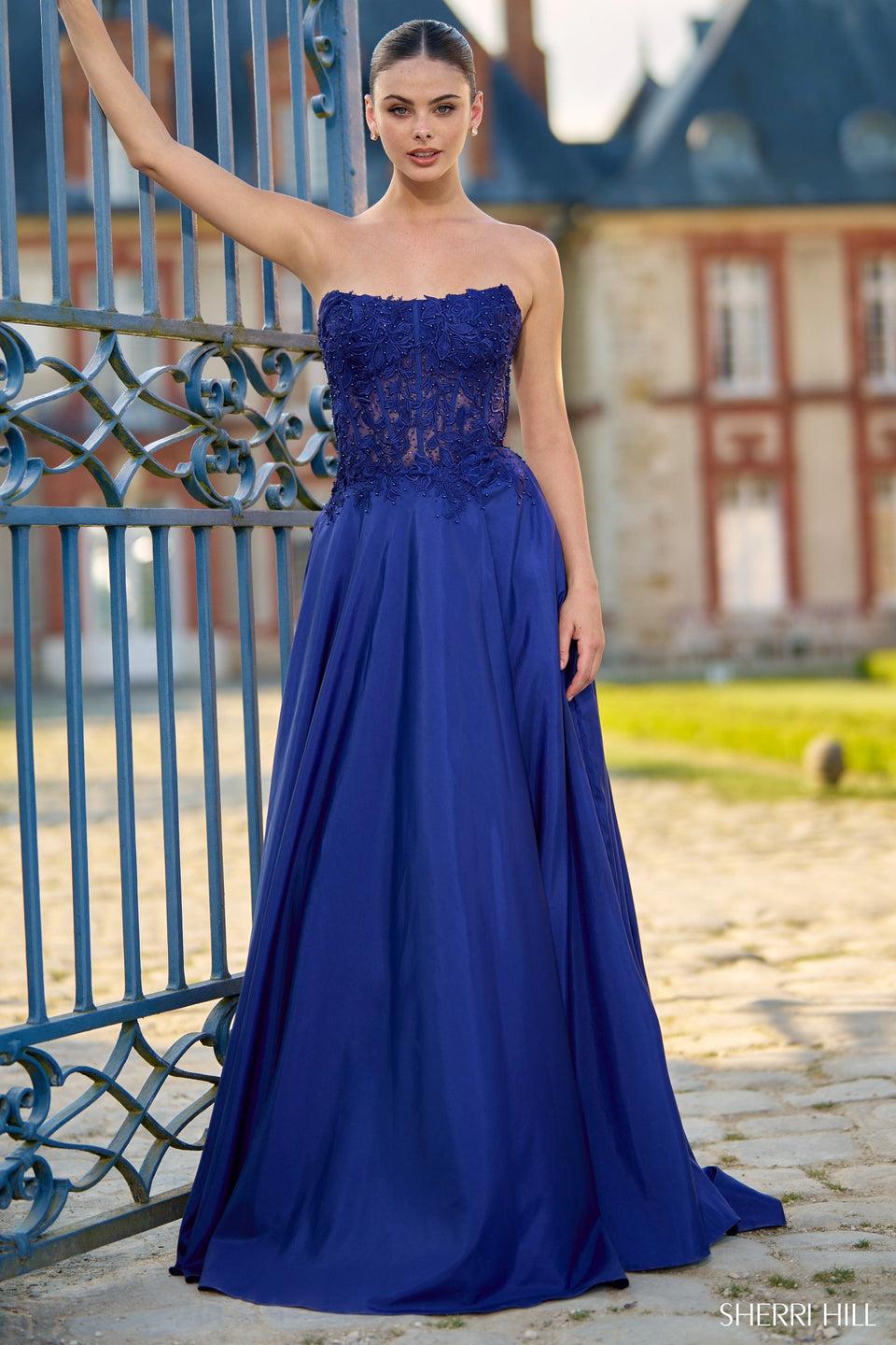 sherri hill Strapless A-line gown with leaf lace corset bodice and a skirt slit