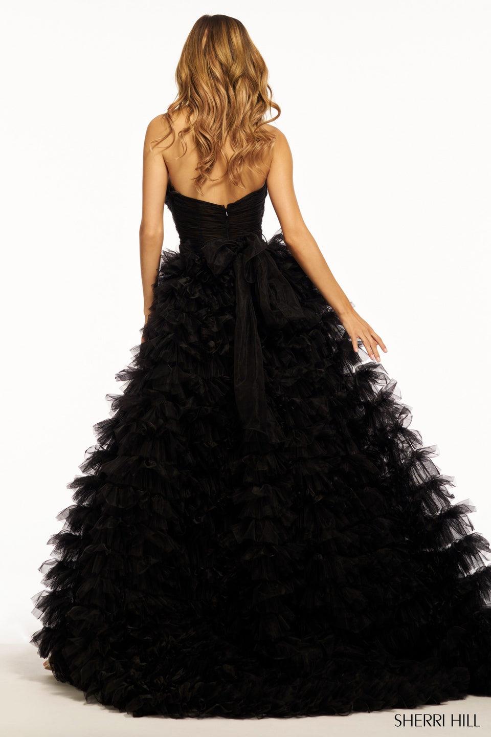 Sherri Hill Strapless Ball Gown With Key Holes Rosette Embellishments And A Tulle Ruffle Skirt With Slit