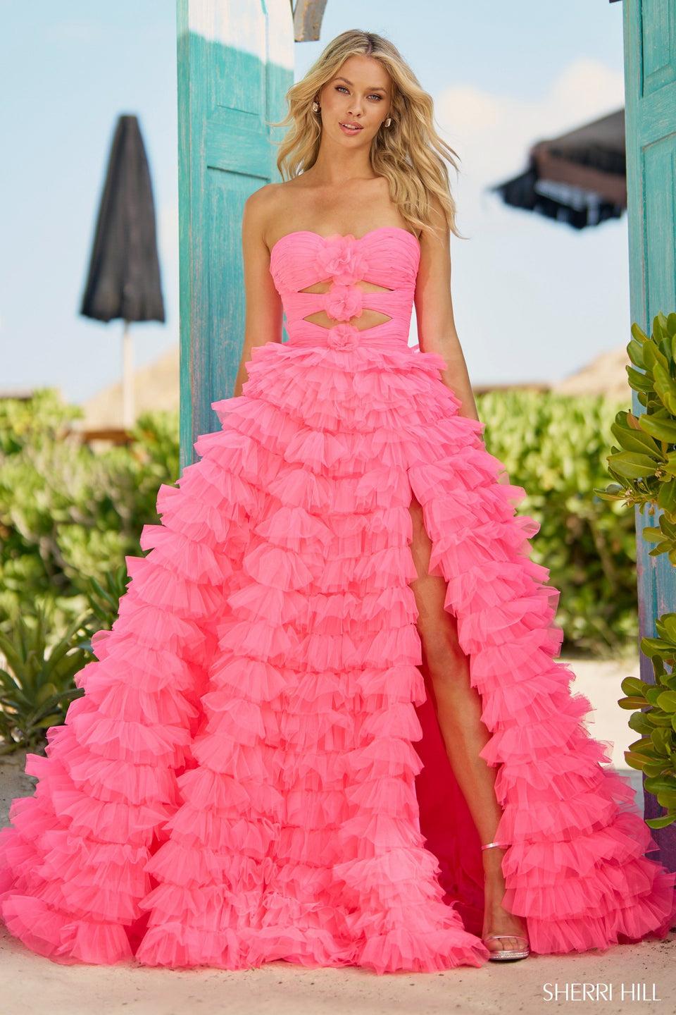 sherri hill Strapless ball gown with key holes rosette embellishments and a tulle ruffle skirt with slit