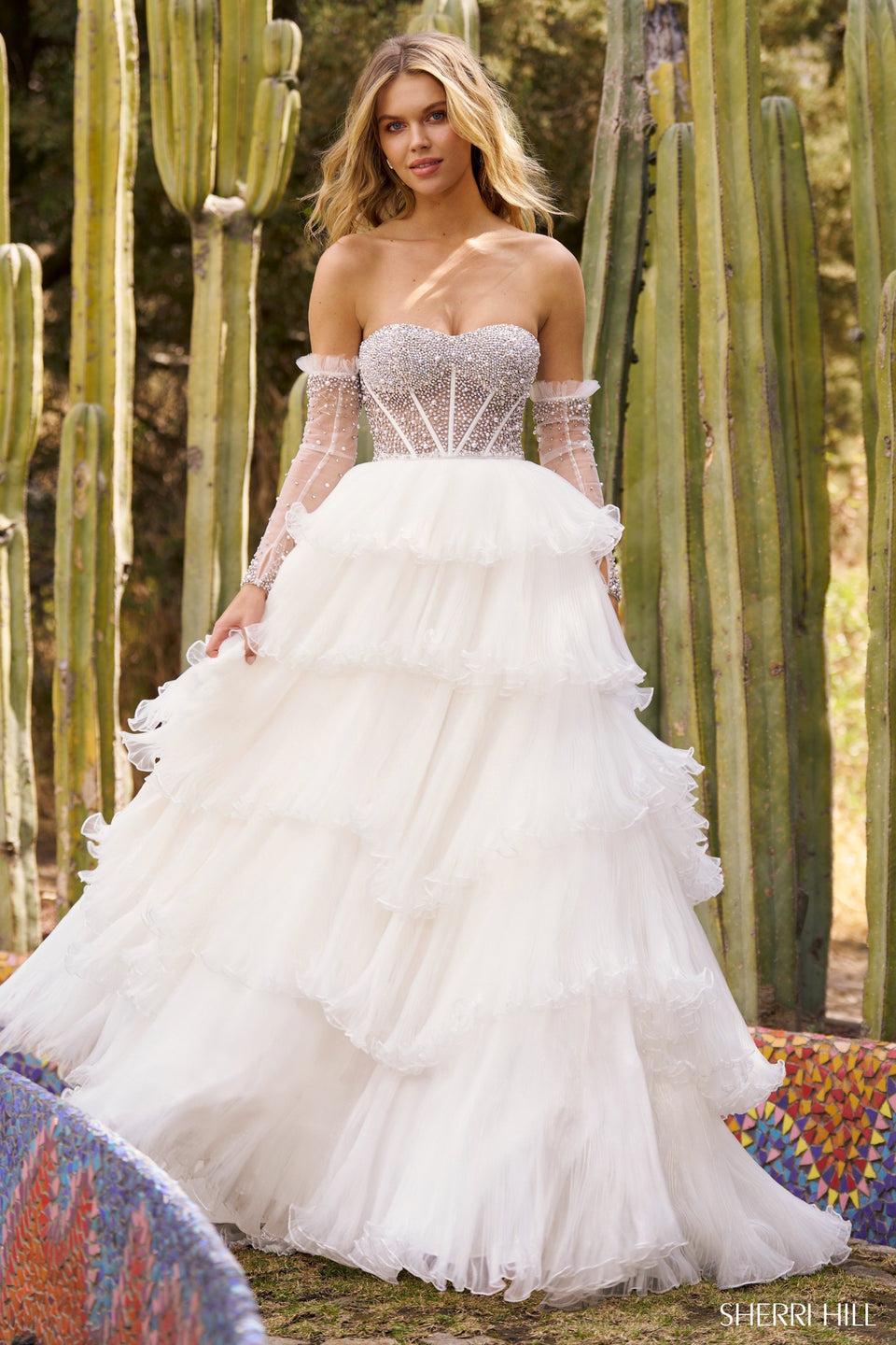 sherri hill Strapless ball gown with sheer corset pearl embellishments pleated organza ruffle skirt and removable pearl sleeves