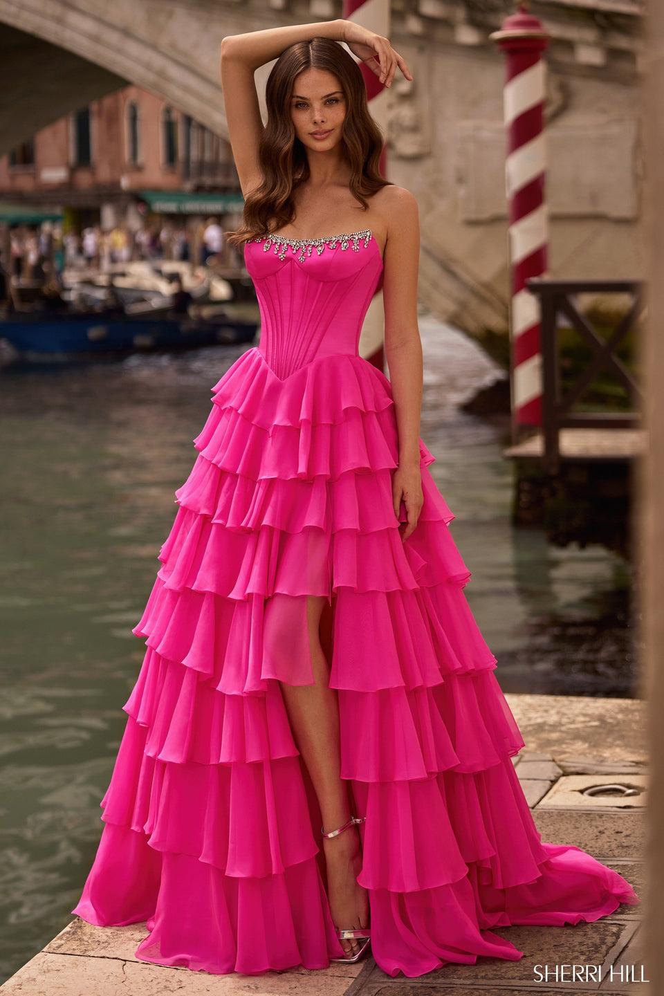 sherri hill Strapless ballgown with corset bodice chiffon ruffle skirt with slit and bead embellishments