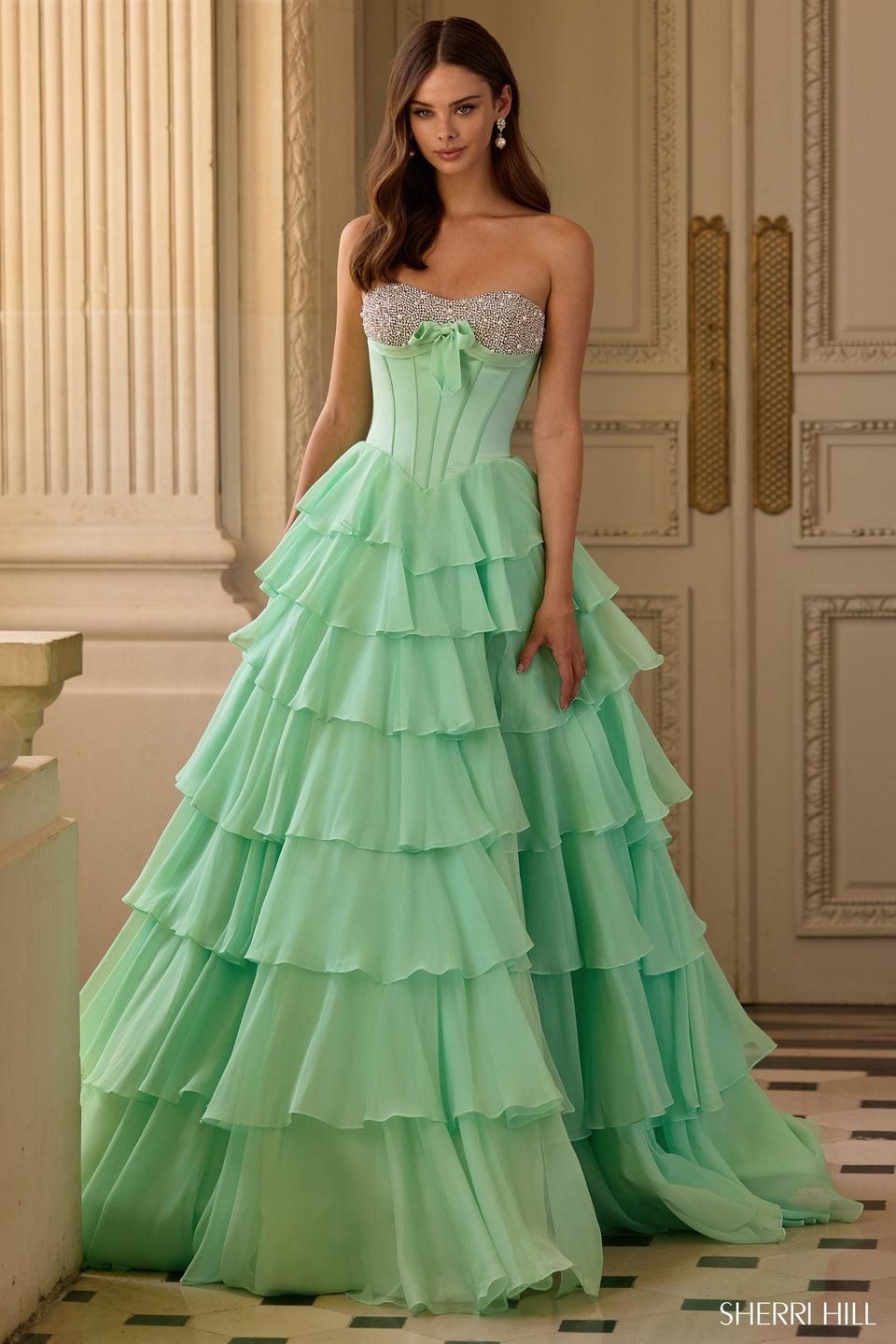 sherri hill Strapless ballgown with corset bodice pearl and bead embellishments and a chiffon ruffle skirt with slit