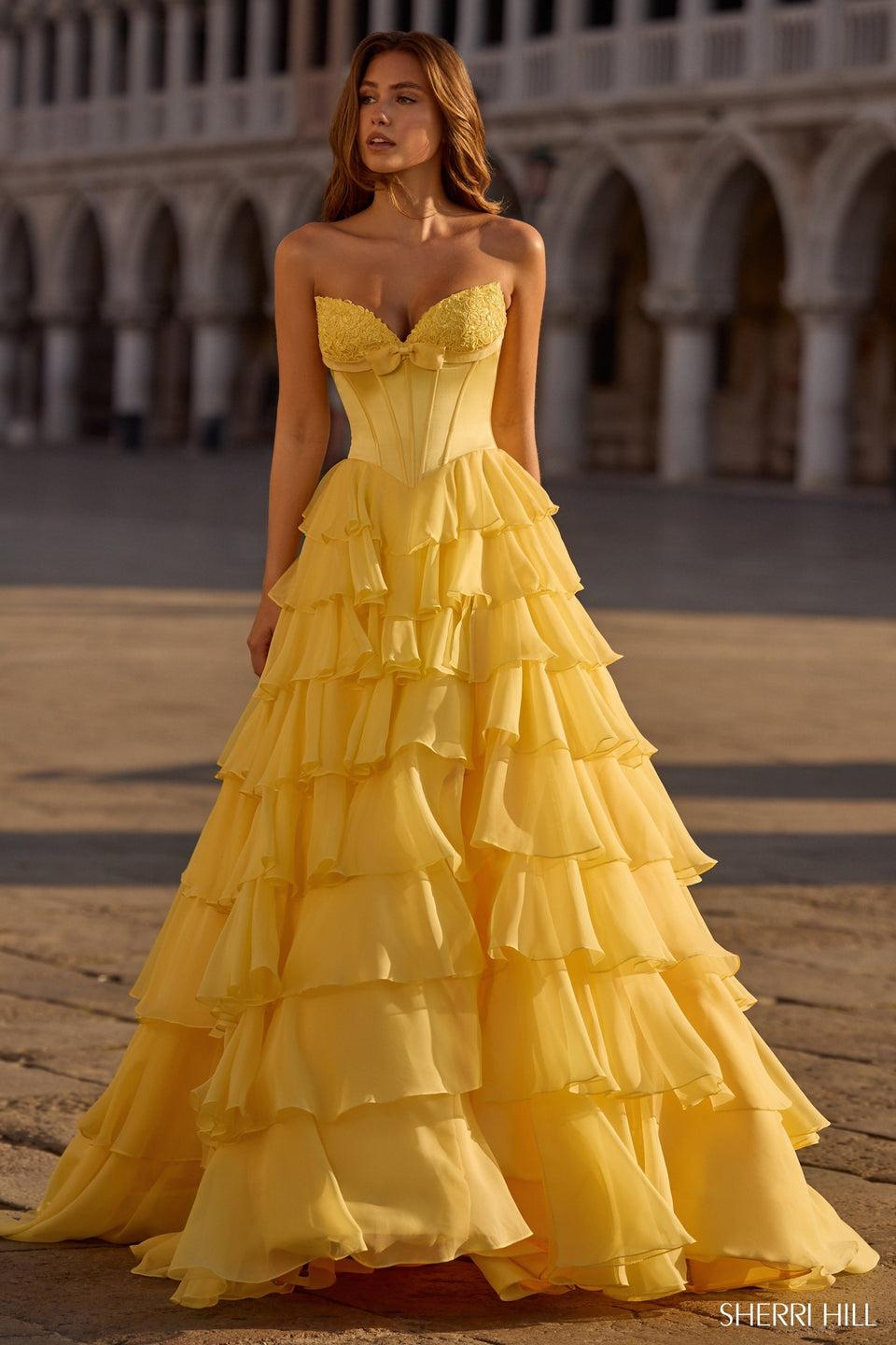 sherri hill Strapless ballgown with silk corset bodice chiffon ruffle skirt bow and skirt slit