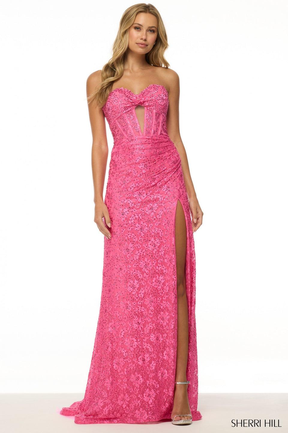 sherri hill Strapless fitted lace gown with corset bodice skirt slit rosette embellishment and a keyhole