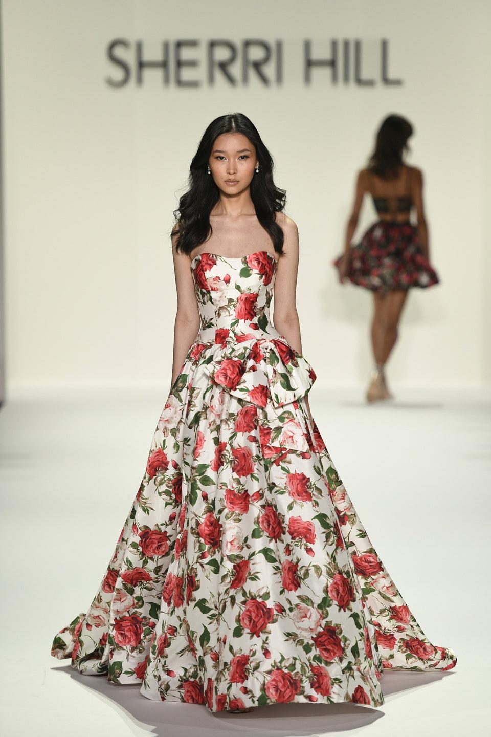 sherri hill Strapless floral gown with bow on side and a skirt slit