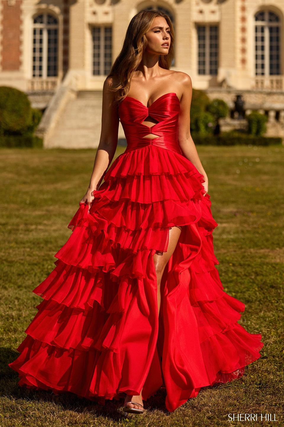 sherri hill Strapless Gown with a stretch satin bodice keyholes and a chiffon ruffle skirt with slit