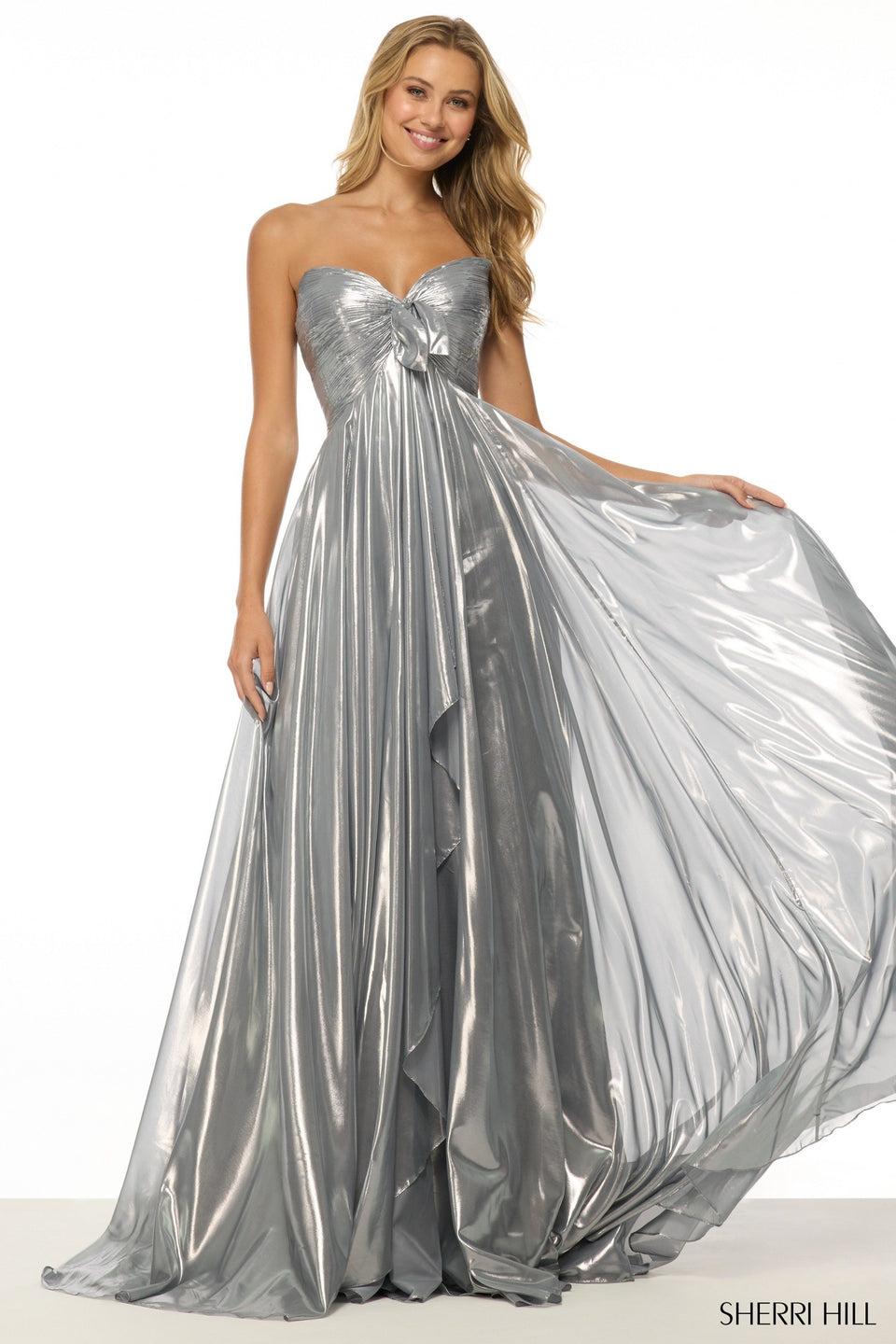 Sherri Hill Strapless Metallic Gown With Skirt Slit And A Bow