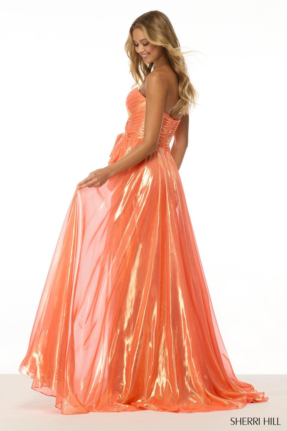 Sherri Hill Strapless Metallic Gown With Skirt Slit And A Bow