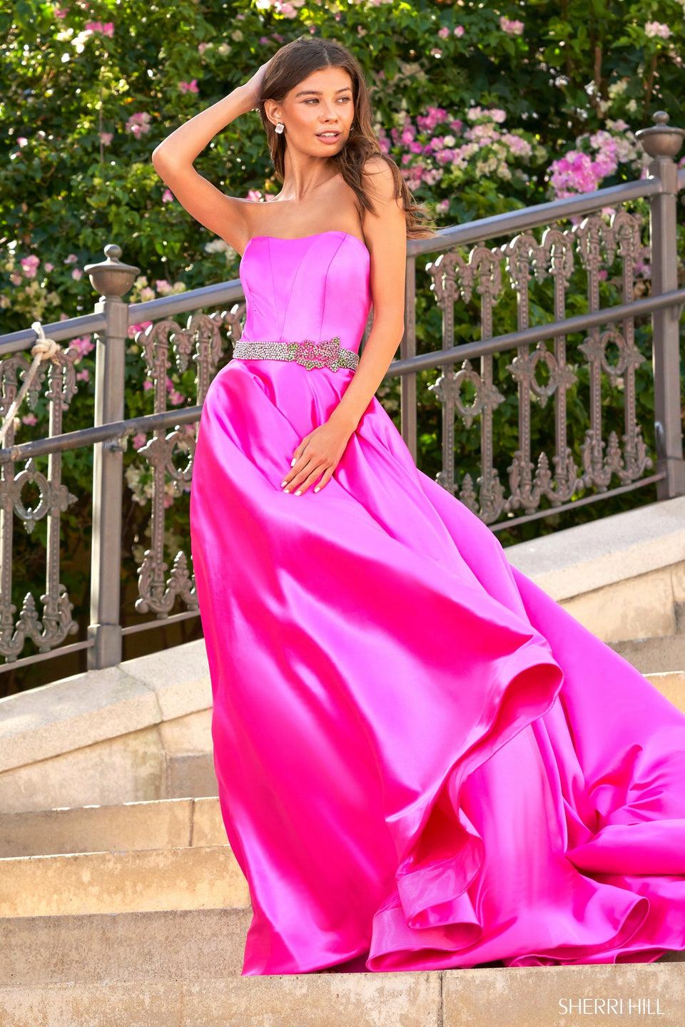 sherri hill Strapless satin ball gown with a beaded belt